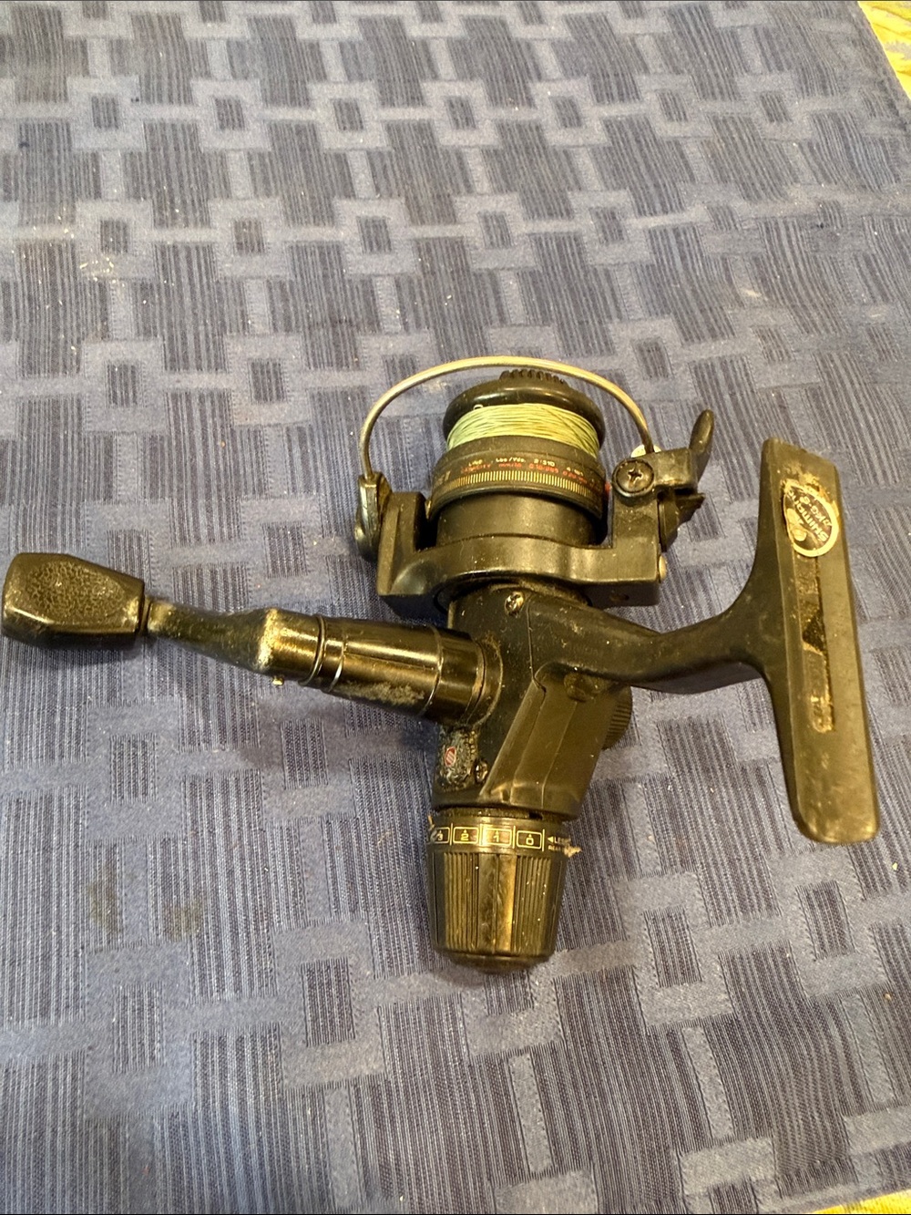 Shimano Black Spinning Fishing Reel with Green Line
